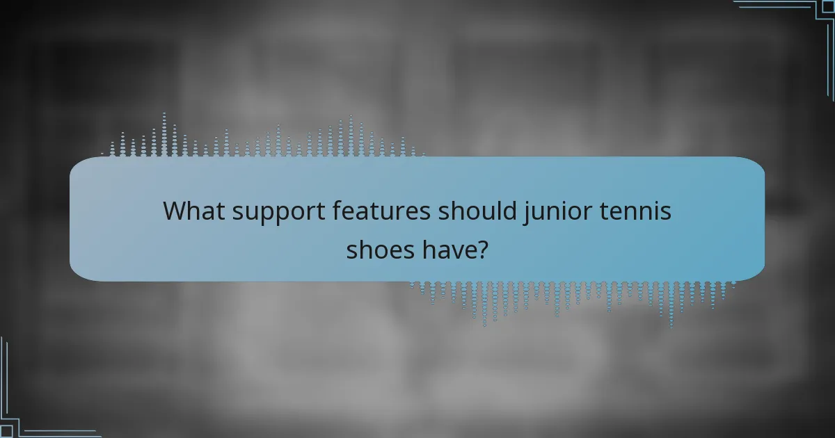 What support features should junior tennis shoes have?
